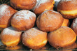 deep fried doughnut covered with powdered sugar