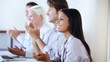 Woman applauding with colleagues in seminar