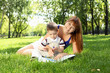 Mother with little son in the park