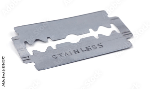 Photo: Old razor blade isolated on white Old razor blade isolated on white