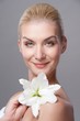 Beautiful blond woman with white lily flower Beautiful blond woman with white lily flower
