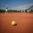 Tennis player in action on tennis court Tennis player in action on tennis court