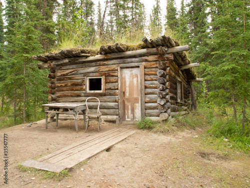 Photo: Old traditional log cabin rotting in Yukon taiga Old traditional log cabin rotting in Yukon taiga