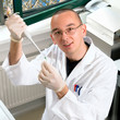 Young researcher in white coat