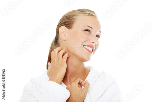 Photo: Young beautiful woman scraching her self. Young beautiful woman scraching her self.