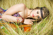 hippie girl lying on a guitar