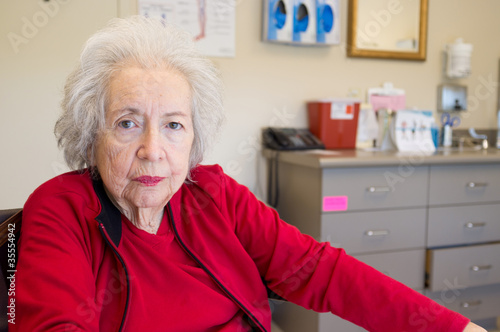 Photo: Elderly 80 year old woman with Alzheimer in doctors office