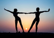 Silhouette of two young women Silhouette of two young women