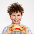 Boy eating big sandwich