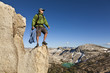Rock climber celebrates on the summit.
