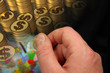 Hand, coin and globe
