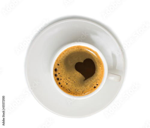 Photo: Coffee in white cup isolated on white background Coffee in white cup isolated on white background