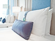 a pillows on beds in a luxury hotel room a pillows on beds in a luxury hotel room