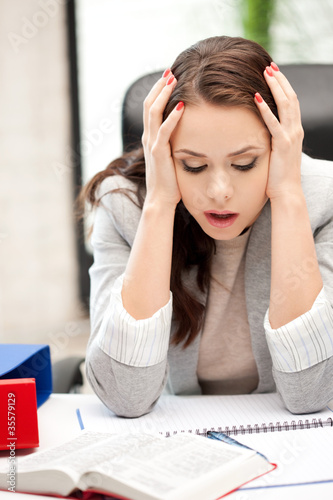 Photo: worried woman with book worried woman with book