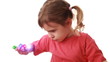 Girl plays with laser flashlights on fingers