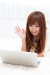 pretty asian woman using laptop