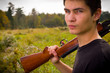 Teenager with gun Teenager with gun