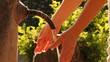 Woman washes hands in stream of water from old rusty tap