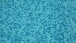 Small heaving waters in pool with mosaic bottom