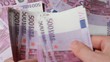 Hands recount souvenir banknote five hundred euros