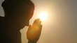 Silhouette of woman head, she is praying