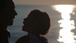 mother and daughter heads with sunshine reflected in water