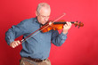 Practicing - mature man on his violin Practicing - mature man on his violin