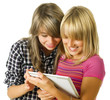 Teenage girls using touchpad. PC tablet