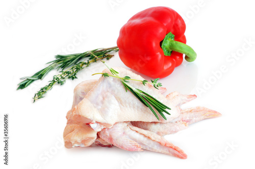 Photo: raw chicken wings with rosemary and red pepper raw chicken wings with rosemary and red pepper