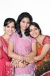 Indian girls hugging each other on an occasion.