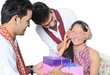 Two brothers giving surprise gift to their sister on festival.