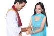 Foto: Sister tying Rakhi on her brother's wrist on Rakshabandhan Sister tying Rakhi on her brother's wrist on Rakshabandhan