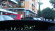 Driving inside car  through narrow streets in city