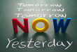 Now, yesterday, and tomorrow words on blackboard
