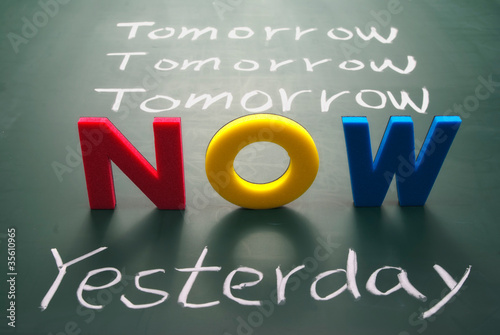 Photo: Now, yesterday, and tomorrow words on blackboard Now, yesterday, and tomorrow words on blackboard