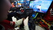 boys play space game with gun on screen of nonreal colors