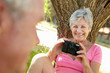 Senior woman with camera