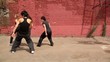 Dance team of four girls dance synchronously