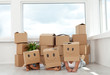 Family having fun with cardboard boxes