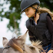 Horseback  riding - little girl is riding a horse