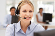 Photo: Businesswoman wearing headset Businesswoman wearing headset