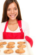 Baking woman showing cookies