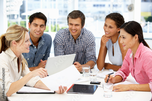 Photo: Mixed group in business meeting Mixed group in business meeting