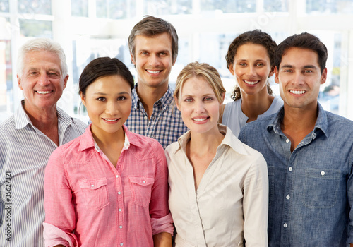 Photo: Mixed group business people in office Mixed group business people in office