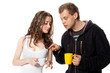 Young man and girl with beverages in cups