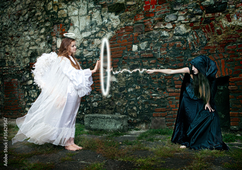 Photo: Magical battle between the witch and an angel Magical battle between the witch and an angel