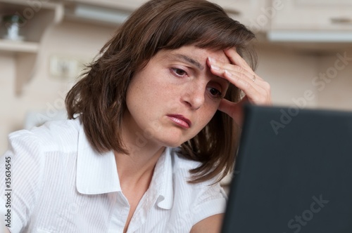 Photo: Depressed and tired business person at work Depressed and tired business person at work