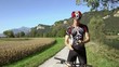 young man with telephone riding mountain bike