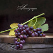 art purple grapes on old wooden background art purple grapes on old wooden background