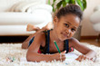 Photo: Little African Asian girl drawing Little African Asian girl drawing